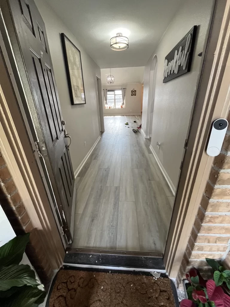 Laminate flooring gracing the entrance of a welcoming home