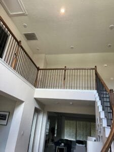 Custom-designed handrails and balusters in progress.