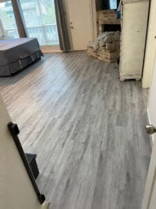 Residential laminate flooring with a clean and polished appearance.