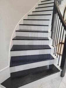 Natural wood treads on a residential staircase.