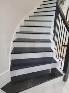 Natural wood treads on a residential staircase.