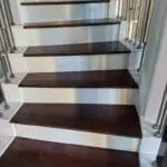 Wooden stair treads with intricate detailing.