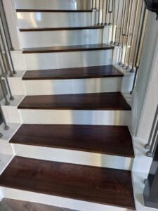 Wooden stair treads with intricate detailing.