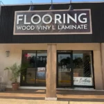 Exterior storefront view of the Two Brothers Flooring and Remodeling showroom located in Pearland, Texas.